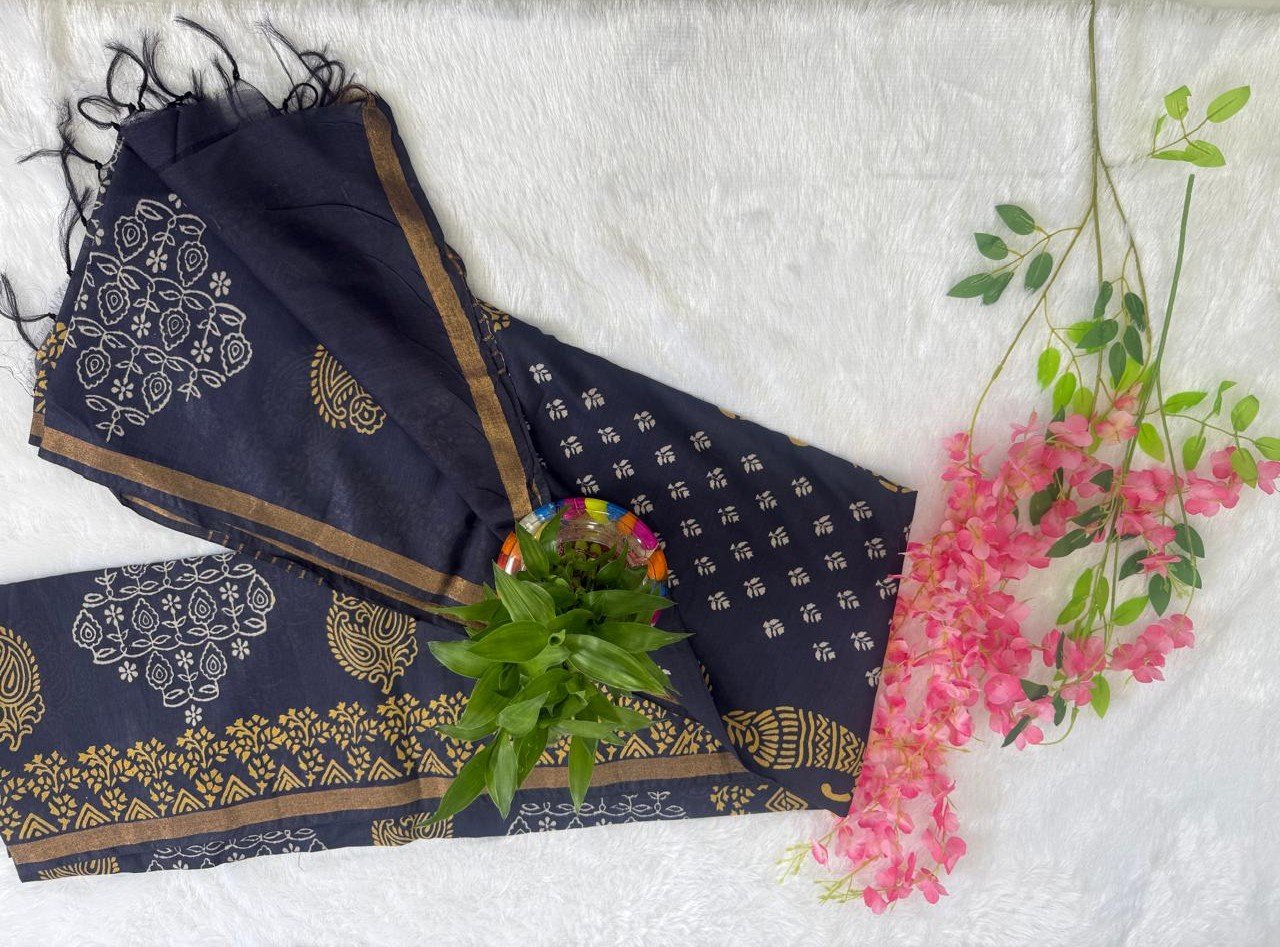 Midnight navy blue saree with golden block printed motifs and an antique gold zari border.