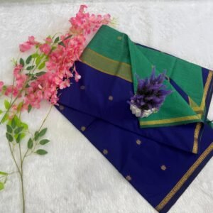 Royal blue saree featuring gold star motifs with a contrasting leaf green pallu and gold zari border.