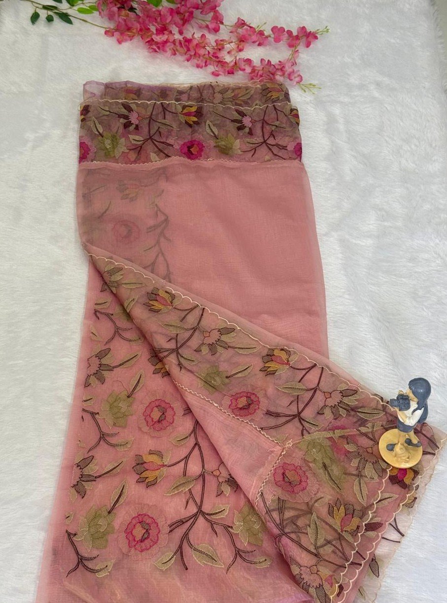 Off-white vintage cream saree with dusty rose floral print and a delicate scalloped embroidered border.