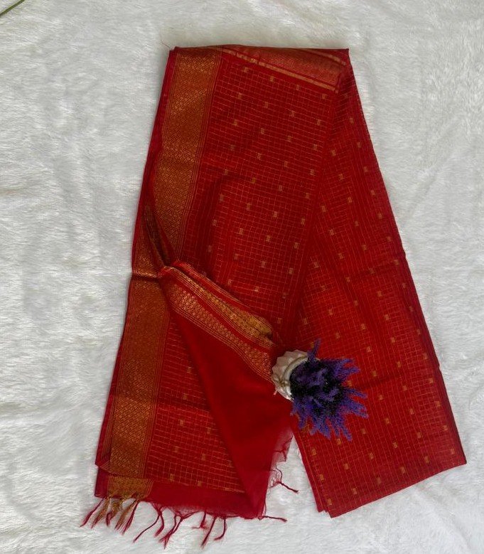 Bright scarlet red saree with fine gold grid checks, tiny gold motifs, and a broad antique gold zari border with red tassels.