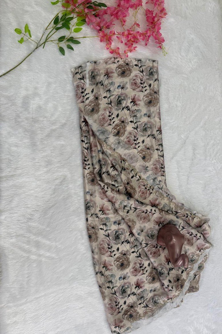 Off-white vintage cream saree with dusty rose floral print and a delicate scalloped embroidered border.