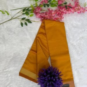 Solid golden mustard yellow saree with a broad gold zari border.